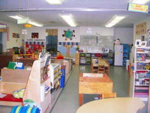 View of an entire pre-K classroom with centers, tables, reading area, bulletin boards supply areas, etc.